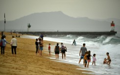 Warm October weather has seen many flock to the beach -- such as here at Hossegor, southwestern France -- but environmentalists see more evidence of climate change