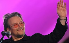 Bono, shown here greeting people as he performs at subway station which is bomb shelter, in the center Kyiv on May 8, 2022, has released a memoir