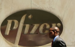 Pfizer lifted its full-year forecast for Covid-19 vaccine sales as it reported higher profits 