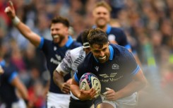 Try-time - Scotland fly-half Adam Hastings (R) scores the second of the hosts' four tries in a 28-12 win over Fiji at Murrayfield