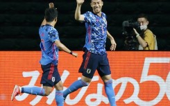 Japan captain Maya Yoshida (right) is hoping to lead his team into the World Cup quarter-finals for the first time in Qatar