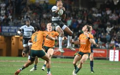 Fiji's Vuiviawa Naduvalo (C) takes a high ball in the final against Australia at the Hong Kong Sevens on Sunday
