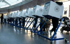 A sign with a US flag is seen at a polling station during early voting ahead of the US midterm elections in Los Angeles, California, on November 1, 2022