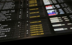An announcement board in the departure hall at Brussels Airport during strike action