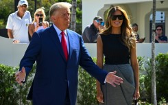 Former US President Donald Trump and his wife, Melania Trump, speak to reporters after voting in Palm Beach, Florida