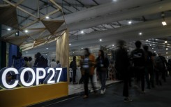 Participants walk inside the Sharm el-Sheikh International Convention Centre during the COP27 climate conference
