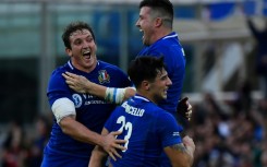 Italy's Michele Lamaro (L), Sebastian Negri (Top R) and Tommaso Menoncello celebrate victory 