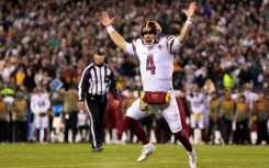 Washington quarterback Taylor Heinicke celebrates a Commanders touchdown as his team upset previously unbeaten Philadelphia 32-21 in Monday's NFL game