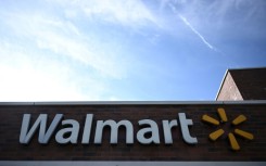 Walmart posted a loss in the third quarter after a settlement resolving claims that it contributed to the nationwide opioid crisis.
