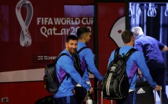 Argentina's Lionel Messi and teammates arrive at the Hamad International Airport in Doha