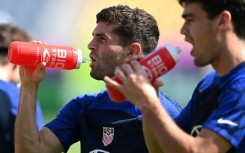 Christian Pulisic (L) aims to change negative perceptions of American soccer at the World Cup