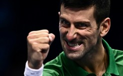 On his way: Novak Djokovic celebrates victory over Andrey Rublev to secure a last-four berth at the ATP Finals and then said he was happy he would be allowed to play in the Australian Open