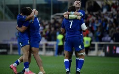 Italy's players celebrate their first victory over Australia
