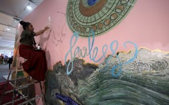 Award-winning Indian artist Shilo Shiv Suleman painted a mural called "fearless" at the youth pavillon, during the COP27 climate summit in the Red Sea resort of Sharm el-Sheikh