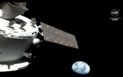 NASA's Orion spacecraft en route for the Moon, with the Earth in the background, in a photo released by NASA in November 2022