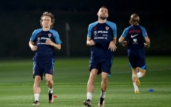 Croatia midfielders Luka Modric (L) and Mateo Kovacic take part in a training session in Doha