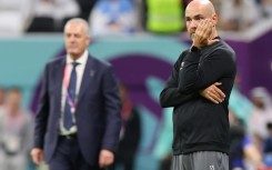 Qatar's Spanish coach Felix Sanchez (R) watched from the touchline