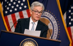 Asian markets are rising on hopes for a slowdown in Federal Reserve rate hikes, though China's growing Covid woes are dragging optimism