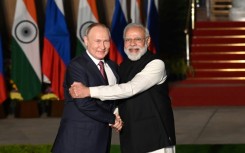 Indian Prime Minister Narendra Modi (R) greets Russian President Vladimir Putin before a late 2021 meeting in New Delhi