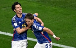 Japan's Ritsu Doan (right) celebrates scoring his team's first goal against Germany in the World Cup