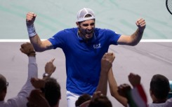 Simone Bolelli celebrates victory with the Italian team 
