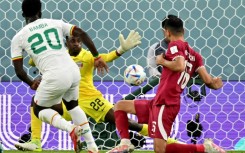 Bamba Dieng (L) sealed Senegal's win which led to Qatar crashing out of their own World Cup