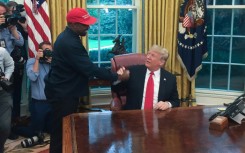 Former president Donald Trump meets with rapper Kanye West in the White House on October 11, 2018