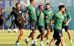 Saudi Arabia coach Herve Renard (L) has his sights set on a place in the last 16