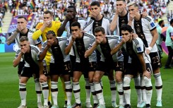 The German players covered their mouths in protest at FIFA's stance on a rainbow-themed armband