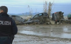 Damaged cars scattered along Ischia's seafront after landslide
