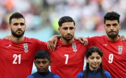 Iran's players, including captain Alireza Jahanbakhsh (C) chose not to sing the national anthem before their opening match