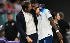 England manager Gareth Southgate hugs Marcus Rashford