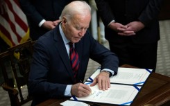 US President Joe Biden signs a resolution to avert a nationwide rail shutdown