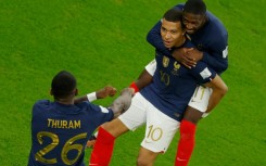 France's Kylian Mbappe (centre) celebrates after scoring the first of his two goals in a 3-1 last 16 win over Poland