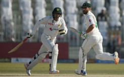 Pakistan's Salman Ali Agha (right) and teammate Zahid Mahmood run between wickets in Rawalpindi