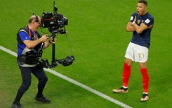 Kylian Mbappe celebrates after scoring in France's win over Poland on Sunday