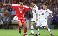 Iranian forward Ali Daei (L) fights for the ball with US midfielder Cobi Jones (R) during their 1998 World Cup clash