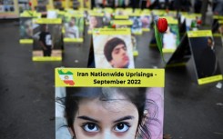 This photograph taken near the French National Assembly in Paris on December 6 shows placards with portraits of the victims of Iran's crackdown