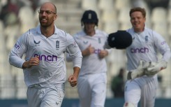 England's Jack Leach (L) celebrates the dismissal of Pakistan's Saud Shakeel, his 100th Test wicket