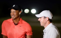 Tiger Woods, left, and top-ranked Rory McIlroy laugh during The Match, which they lost to Justin Thomas and Jordan Spieth 