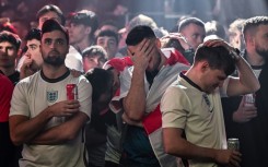England fans in Manchester are despondent after France open the scoring in the World Cup quarter-final