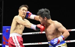 Pacquiao (R) lands one on D.K. Yoo in Goyang, South Korea, on Sunday