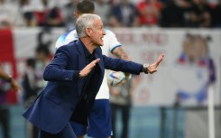 Deschamps passes on instructions from the touchline during Saturday's quarter-final against England
