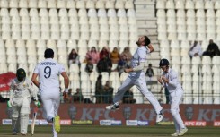 England's Mark Wood  celebrates after taking the wicket of Pakistan's Zahid Mahmood