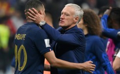 France coach Didier Deschamps embraces Kylian Mbappe after his side beat Morocco to reach the World Cup final