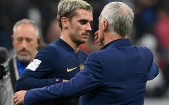 Antoine Griezmann embraces France coach Didier Deschamps after the holders beat Morocco to return to the World Cup final