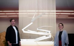 Dutch artist Thijs Biersteker (L) and scientist Adriana de Palma pose in front of "ECONARIO" an art installation by Biersteker, during the United the Nations Biodiversity Conference (COP15) in Montreal