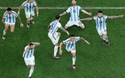 Lionel Messi (2nd R) celebrates after winning the World Cup with Argentina