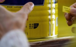 A Hong Kong factory replaces a 'Made in Hong Kong' label in 2020 after the US said goods produced in the city must be marked 'Made in China'