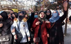 Small groups of Afghan women staged protests in Kabul Thursday to protest against them being banned from university